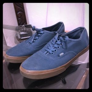 Blue low top Vans with gum bottoms